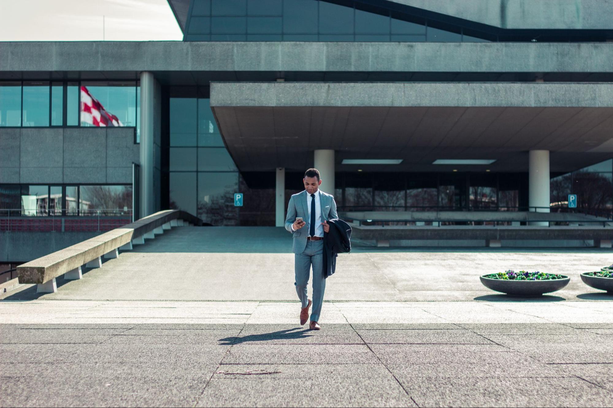 An investor walking outside a building