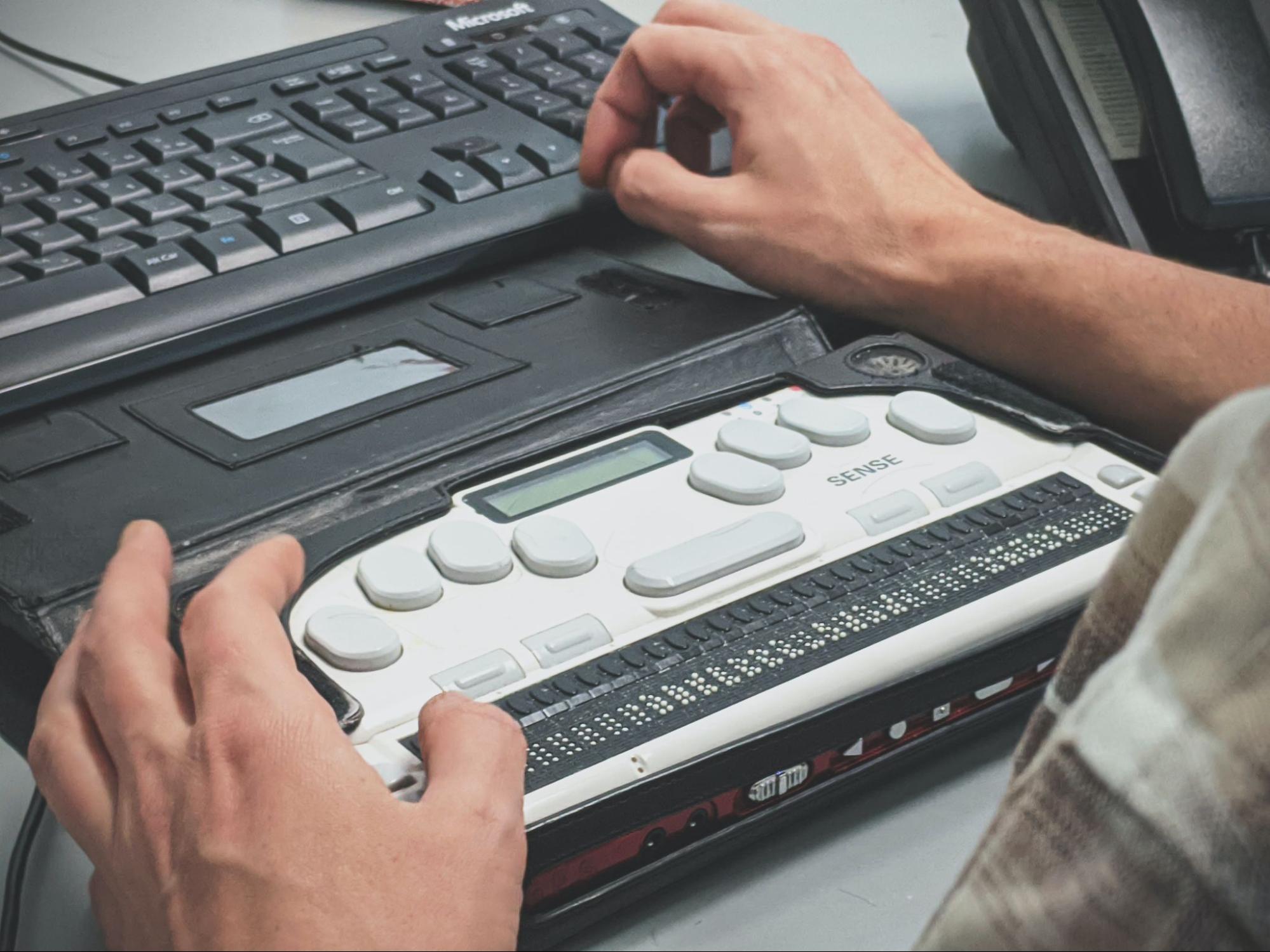 A person using an accessibility testing device.