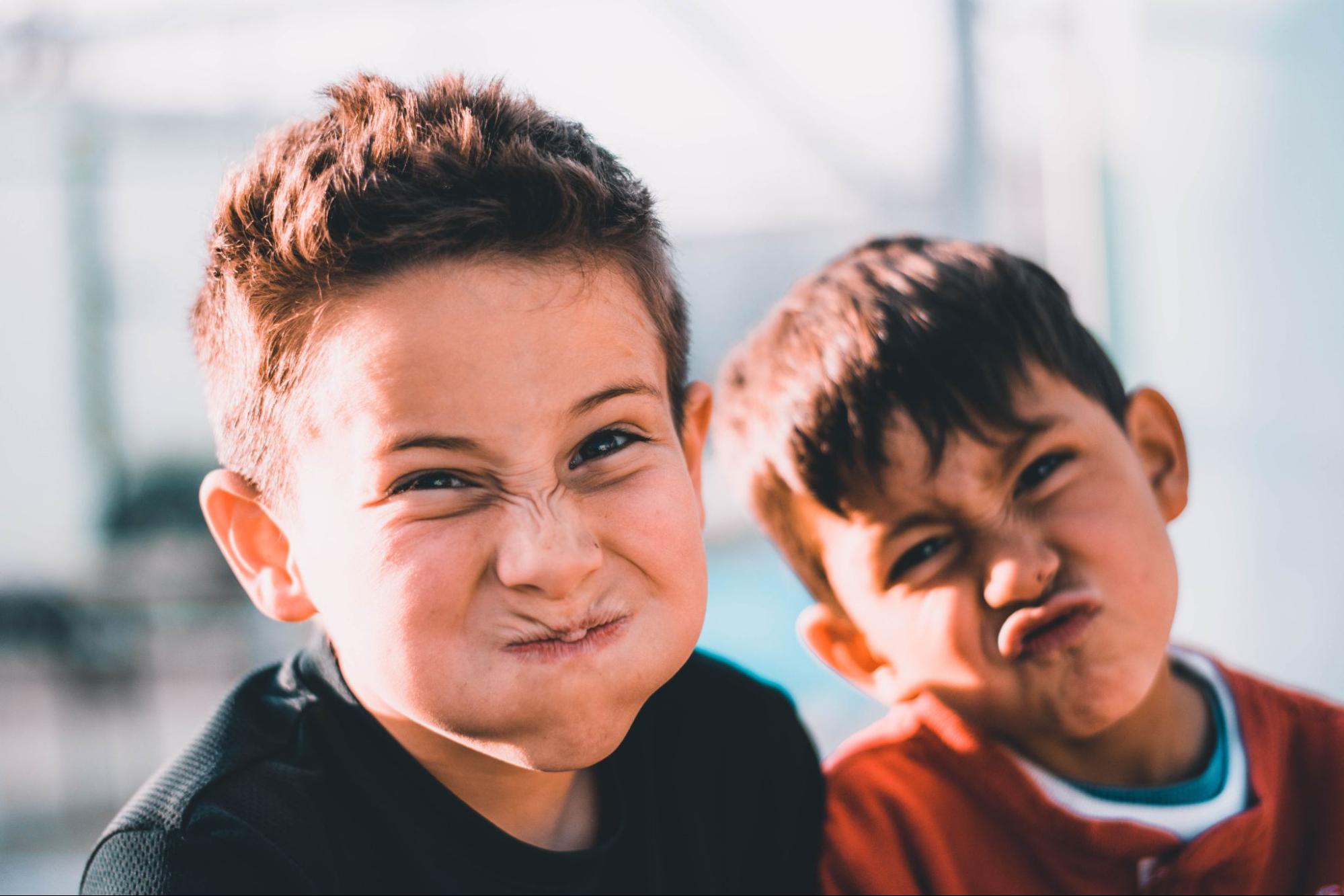 Two children making silly faces.