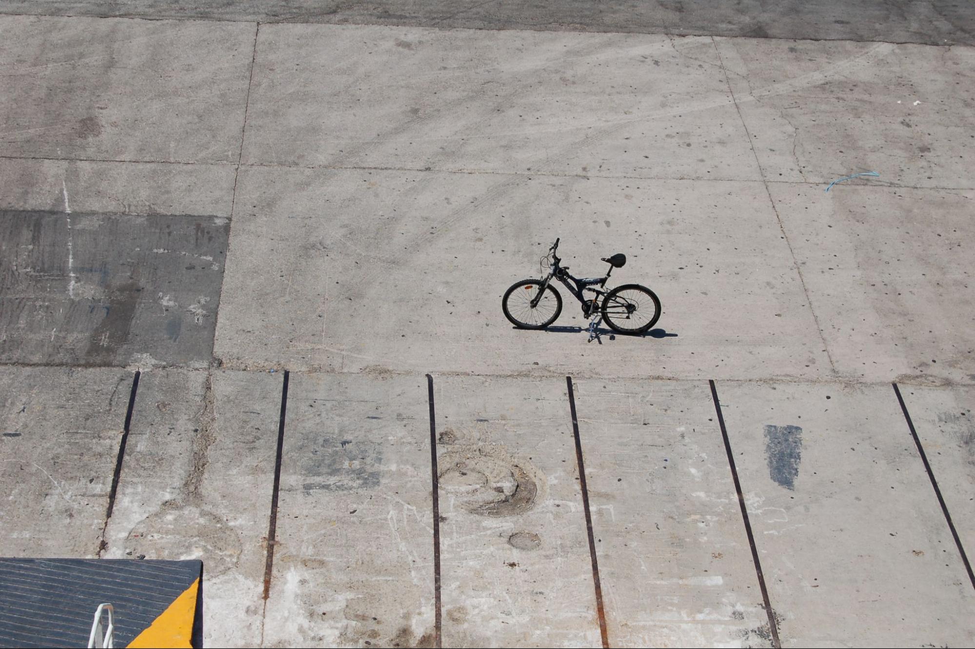 A bicycle on a concrete surface.