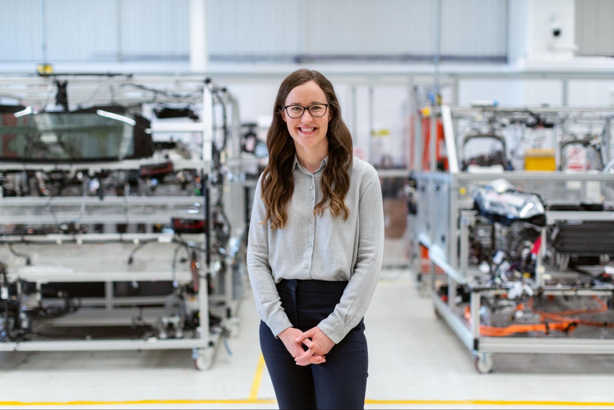 A smiling female electronics engineer.