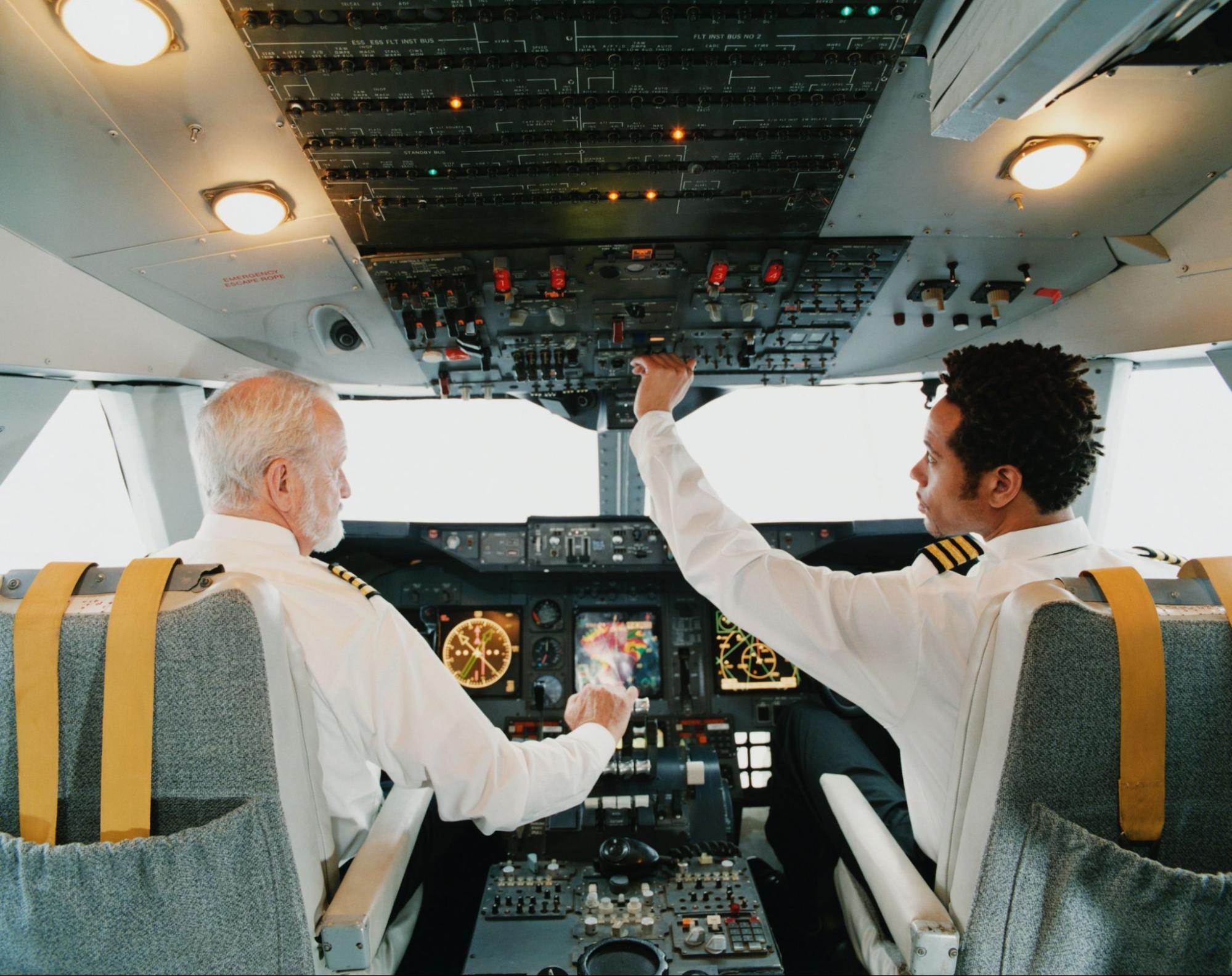 Two men in a aircraft.